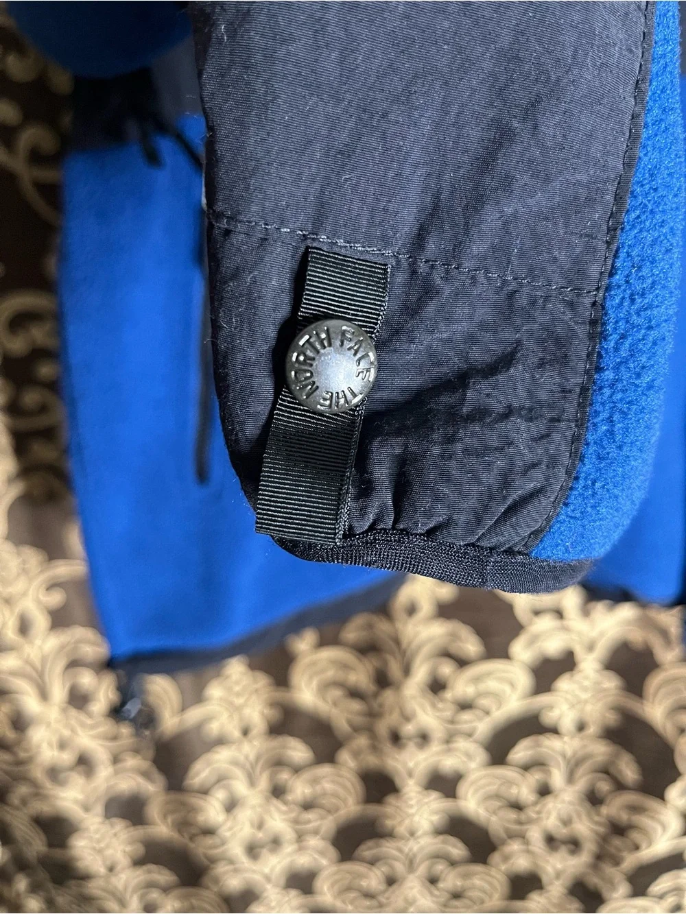 The North Face Men’s Black Denali Jacket with Blue Fleece Lining